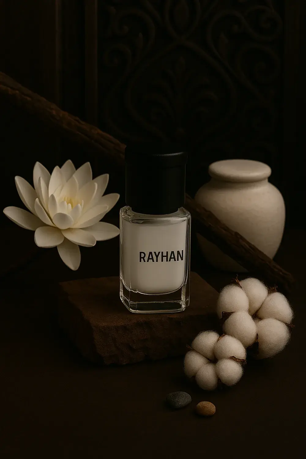 Rayhan Scents Al-Tahara Musk in a white bottle beside a white lotus bloom and a ceramic jar of musk pearls.