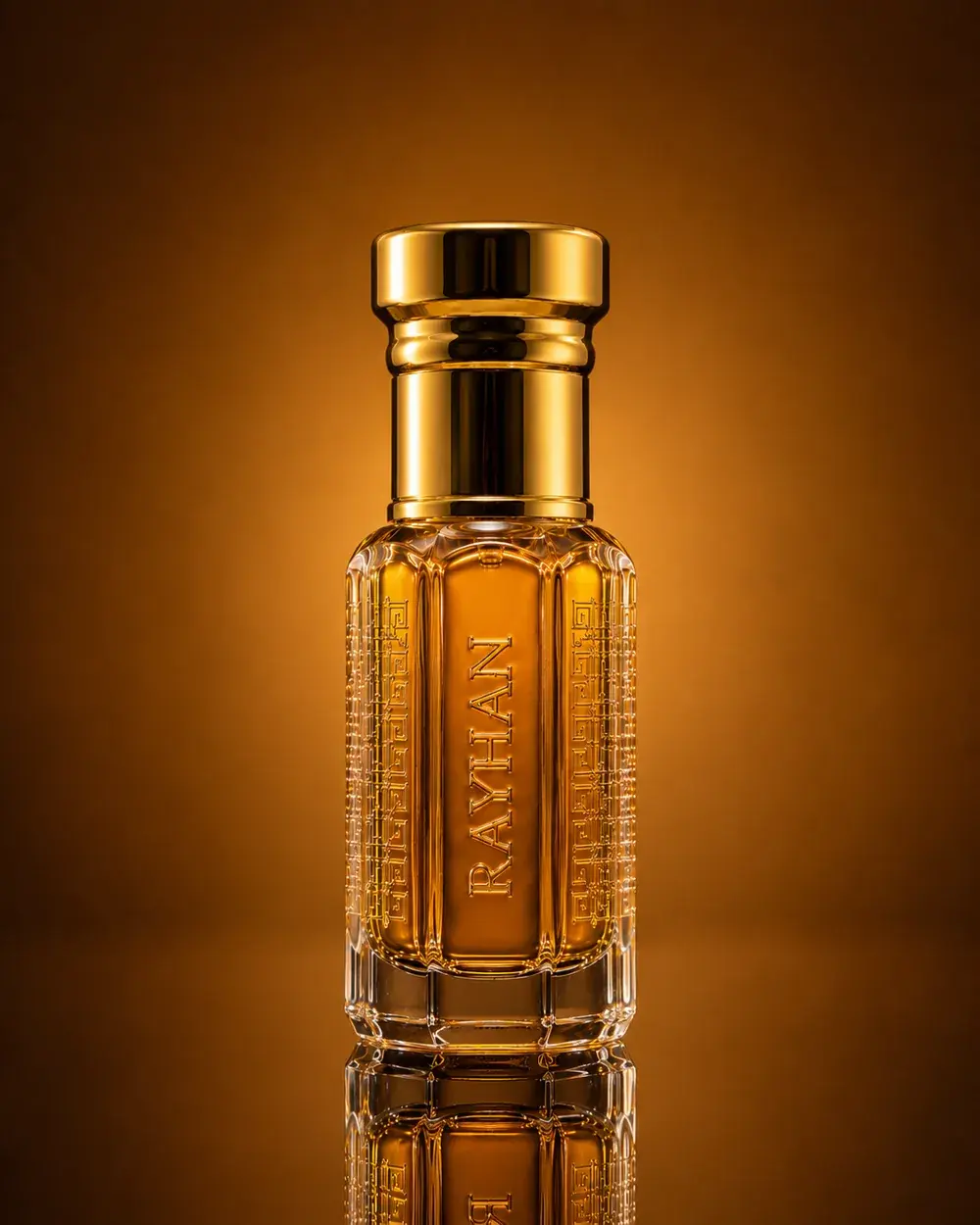 Khamra Oud in a faceted flacon with a gold cap, the oil a dark date-syrup brown against warm bronze.